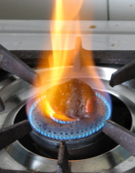 heating coal on flame