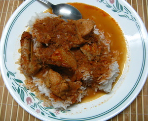 thai red chicken curry with rice on a plate